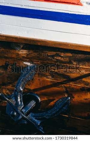 An anchor of a beautiful wooden ship
