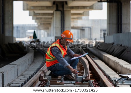 construction worker on railways. Engineer work on railway Royalty-Free Stock Photo #1730321425