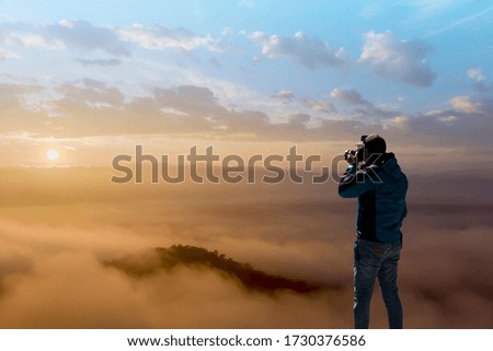 Man Standing On take photo Scenic View Of twilight cloud on sky, Winter landscape. 