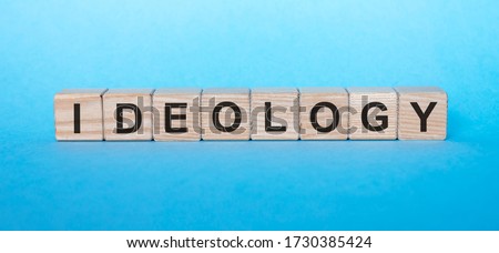 Ideology word text written on wooden cube blocks with blue background. Political or corporation concept