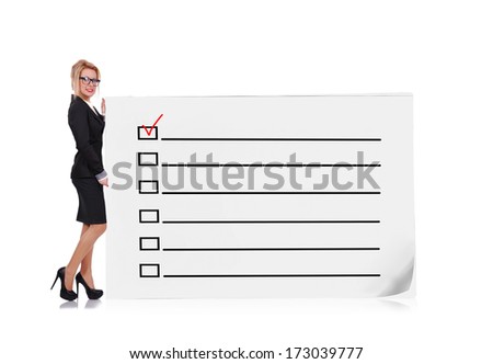 businesswoman holding big poster with check box