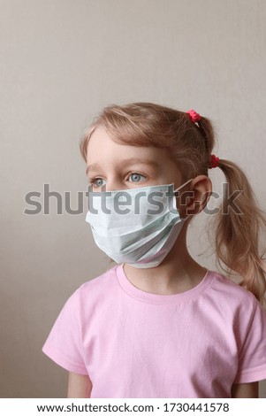 Little girl in the medical mask. Corona virus or covid-19 viral disease outbreak effect to people lifestyle and healthcare concept. Stay home.