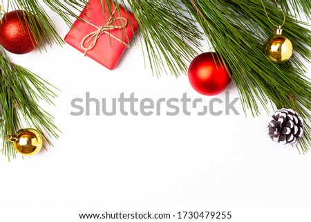 Background for the New Year, Christmas. Christmas toys and Gift in red paper, white cone. Place for text. Royalty-Free Stock Photo #1730479255