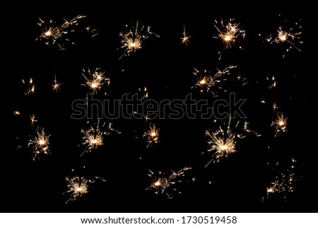 A Pattern of Sparkler Fireworks on Black