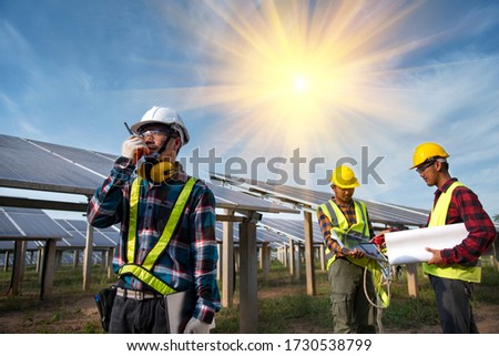 The technician team of solar electric engineers will inspect the maintenance of solar panels.