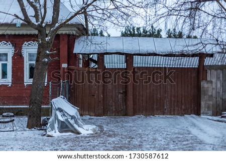 View of the gate standing near the Russian house.  Russian village, somewhere deep in Russia￼