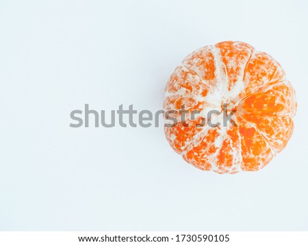 closeup picture of a tangerine on a white background in flat lay style