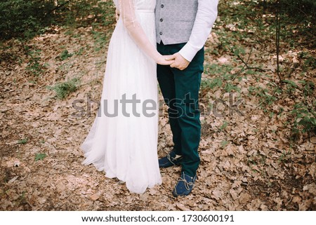 Amazing smiling wedding couple. Pretty bride and stylish groom. Boho wedding. Rustic Bridal Bouquet