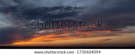 Blackout. Purple-magenta clouds. Tragic gloomy sky. Landscape with bloody sunset. Fantastic skies on the planet earth. Twilight, nightfall. Royalty-Free Stock Photo #1730604094