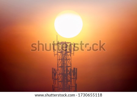 Big sunset on communication towel on big red sun sky and cloud background, beautiful landscape on technology on nature sky, high view on top telecommunication for broadcast satellite signal industry