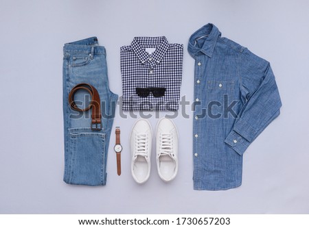 Fashion clothing and accessories on gray background ,flat lay,
