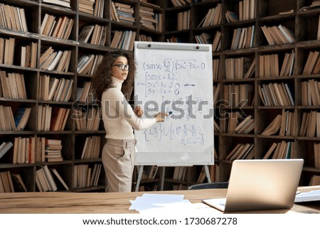 Young hispanic woman professional tutor teaching live math class explaining remote course lesson. Latin female college teacher conferencing by zoom online video call virtual computer lecture concept. Royalty-Free Stock Photo #1730687278