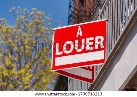 A Louer sign (For rent in french) posted in front on balcony fence