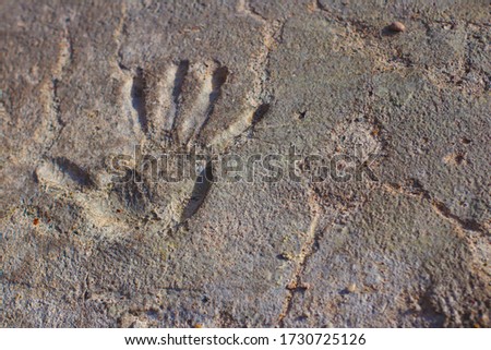 Handprint on an old concrete Royalty-Free Stock Photo #1730725126