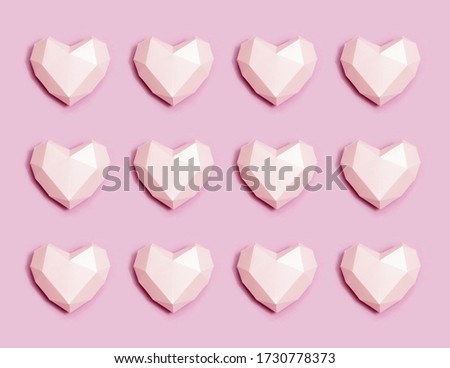 Pattern from pink polygonal paper hearts. Holiday background for Valentines Day. Love concept. Plain colored. Monochrome image. Minimal style.