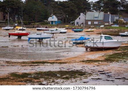 Tregastel. boats at low tide on the coast of Brittany, France
