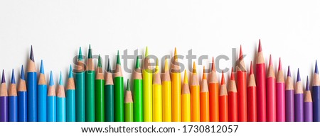 Crayons - colored pencil set loosely arranged  on white background. colored pencils are not arranged exactly in a row. Royalty-Free Stock Photo #1730812057