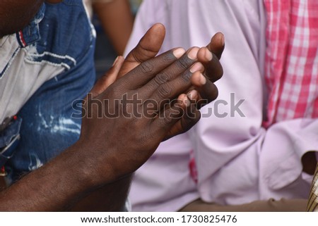 The Dark cheerful clapping hands  Royalty-Free Stock Photo #1730825476