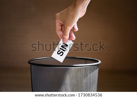 Litter or throw a piece of paper written "sin" into the trash. Concept: Repent from sin or quit from doing sin Royalty-Free Stock Photo #1730834536
