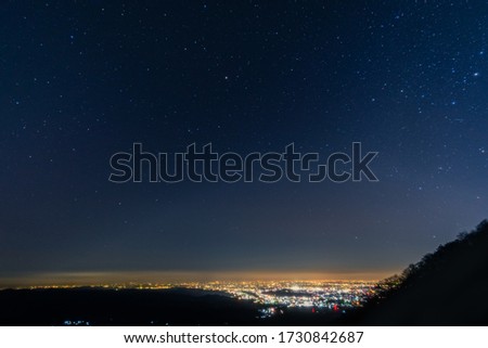 stars with sunrise in beautiful blue hour from top of the hill.