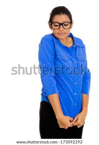 Closeup portrait of a young nerdy looking woman with big glasses, very timid suspicious shy and anxious looking away down isolated on white background. Mental health, emotion facial expression feeling