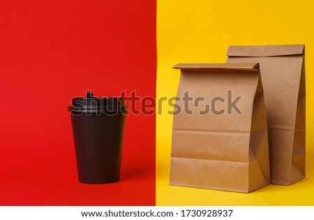 Coffee cups and takeaway food package. Takeout meal concept