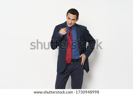 Man red tie blue shirt trousers