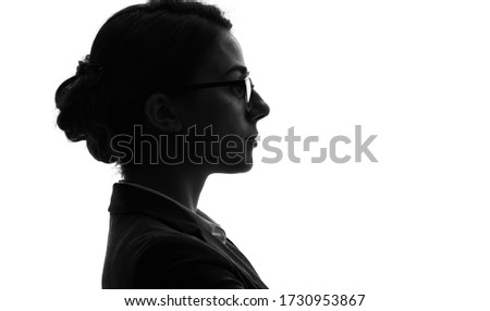Profile silhouette of young woman.