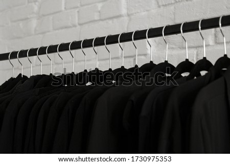 Total black clothes hanging on a hanger
Clothes store in the shopping mall.