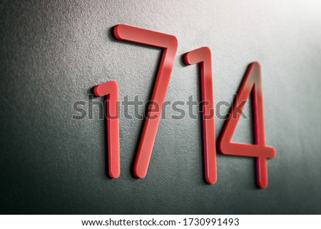 number on the door of a room, apartment, or hotel room. Low depth of field