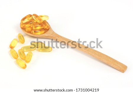 Omega 3 capsules or Fish oil pills in spoon on white background ,Health support and treatment.