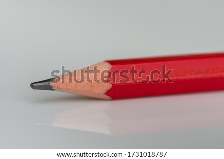 red  pencil in high resolution isolated on black background