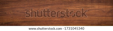 Walnut wood texture. Super long walnut planks texture background or ceramic tile.
