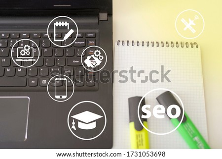 Seo and icons, the concept of development of the system. Information icons on the background of a computer and a person.