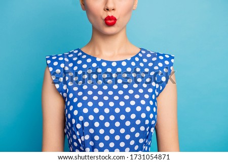 Cropped closeup photo of pretty lady show perfect red lips allure tempting shape sending air kiss wear dotted white retro blouse shirt isolated blue color background