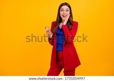 Crazy astonished freelancer girl addicted blogger use cellphone impressed social network novelty scream wow omg wear red blazer jacket pants trousers isolated bright shine color background