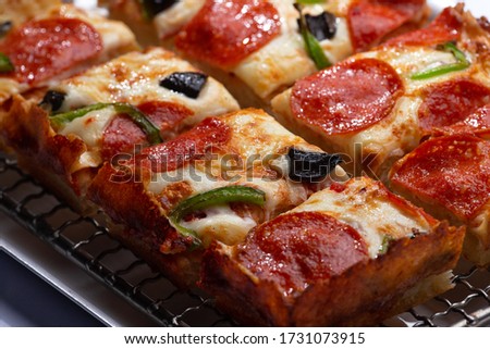 detroit pizza on an iron tray. selective focus Royalty-Free Stock Photo #1731073915