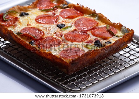 detroit pizza on an iron tray. selective focus Royalty-Free Stock Photo #1731073918