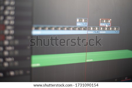 Video editing on a computer screen, close-up. The professional editor works with video tracks on the timeline in the editing program. Post-production in the production of the film