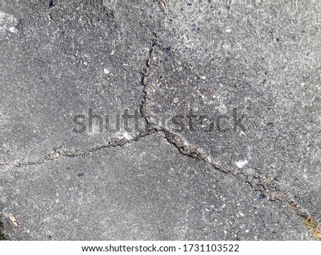 Overhead photo of crack in concrete,Crack in Pavement on City Street