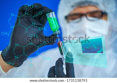 Concept: futuristic medicine, medical care, a microbiologist doctor with a syringe takes DNA from a test tube and a hologram of the patient’s DNA appears. 