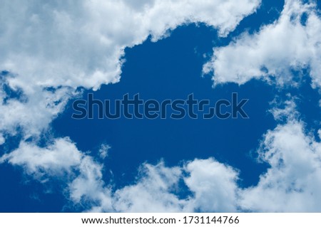 Blue sky and white clouds background. Beautiful summer sky with light white clouds