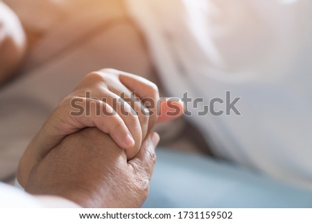 Loving couple holding hands, Hopeful, care love emotional concept, Together women hold hand lover while Sick Patients with Infusion pump infuses fluid. Encouragement comforting Recovering from family
