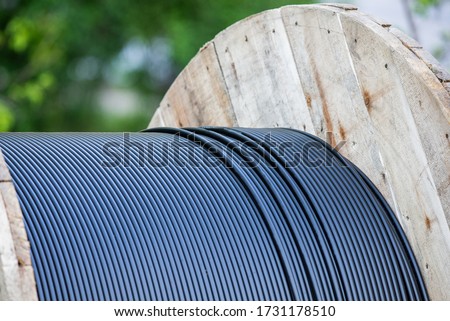 Cable drum, fiber-optic and technology Royalty-Free Stock Photo #1731178510