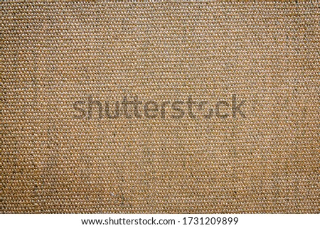 Closeup detail of soft cotton fabric seamless of brown carpet texture and background, shot from above. Designed for home use. Background and texture concept. Copy space for your text.