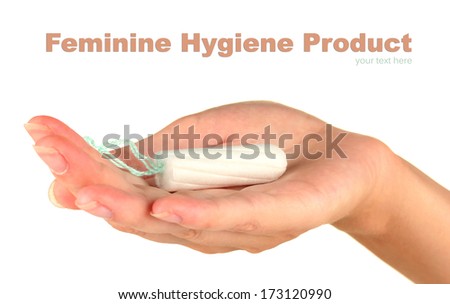 woman's hand holding a clean cotton tampon on white background close-up