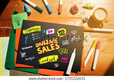 Lay out with digital colorful illustration on black paper about online sales
