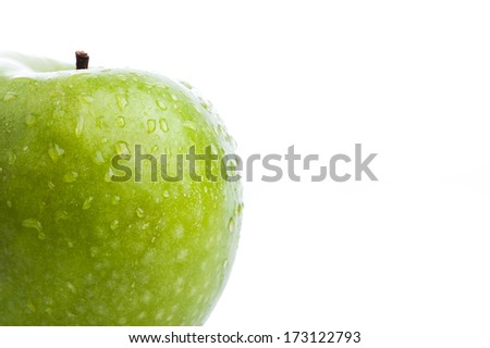 Wet fresh green apple with shiny water drops on isolated white backround, the pantone color of the year 2017, Greenery 15-0343