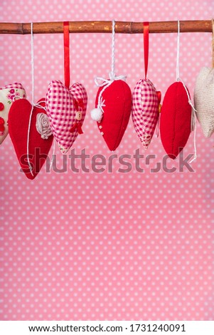 fabric hearts on a pink background
