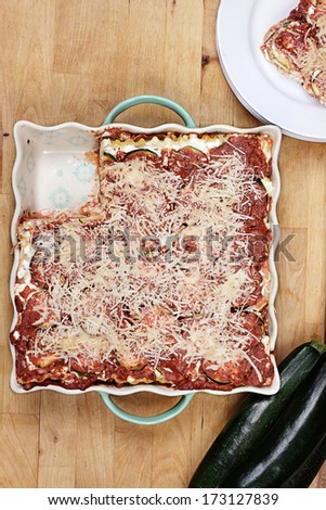 Delicious zucchini lasagna with a slice missing. 